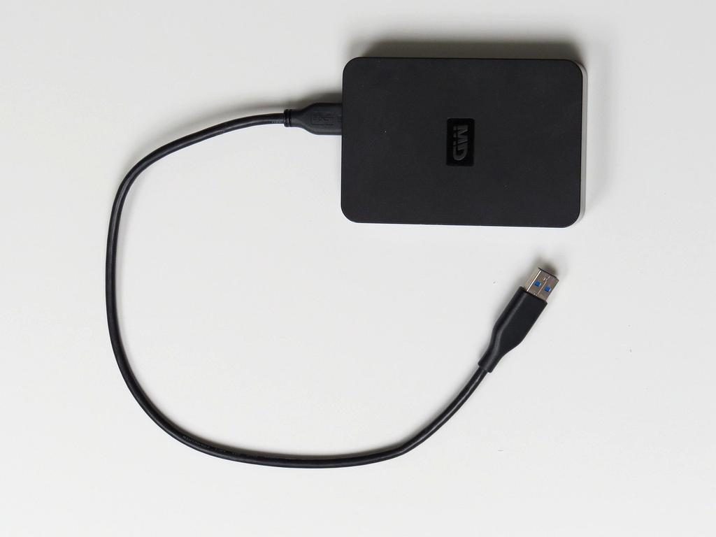 Close-up of modern hard drives stacked inside server rack